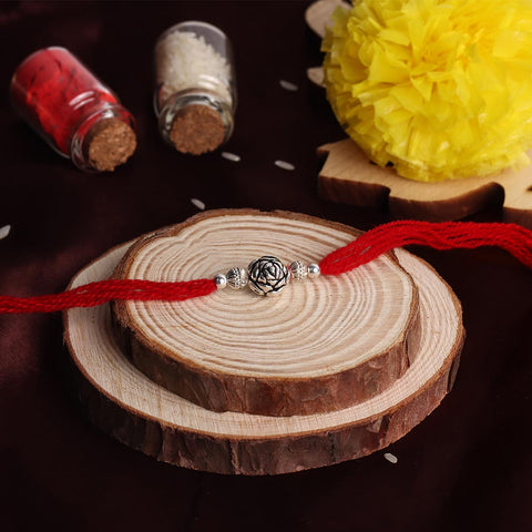 Silver Rose Design Bali Beads With Shiny Beads Rakhi