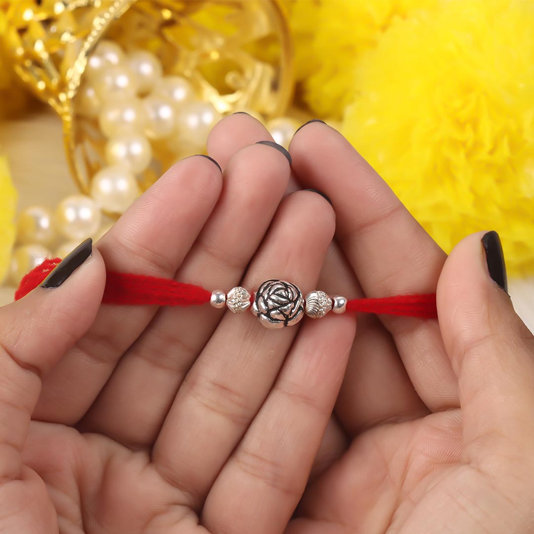 Silver Rose Design Bali Beads With Shiny Beads Rakhi