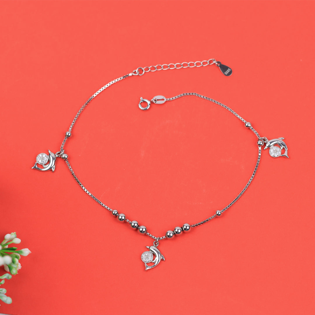 Silver hanging dolphin anklet