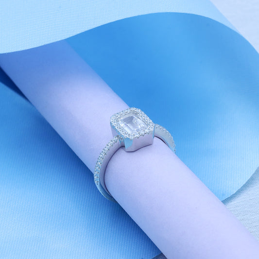 Silver emerald cut diamond solitaire ring