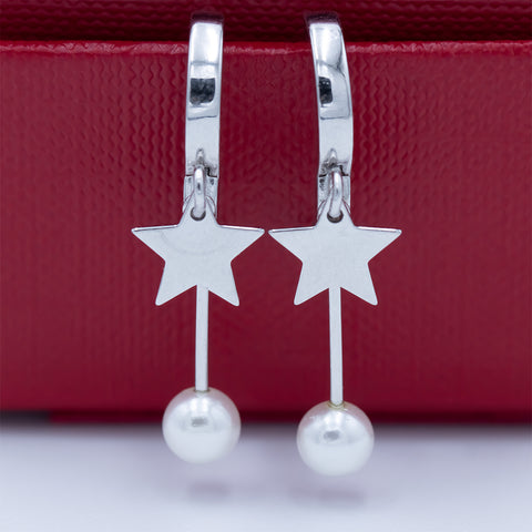 Silver hoops with hanging star and pearl earring