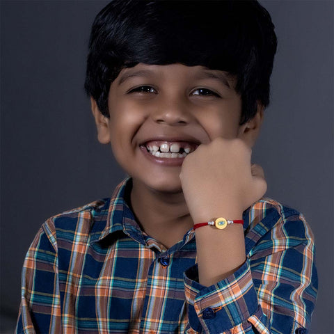 Yellow Round Shape Evil Eye With Silver Beads Rakhi for Kids