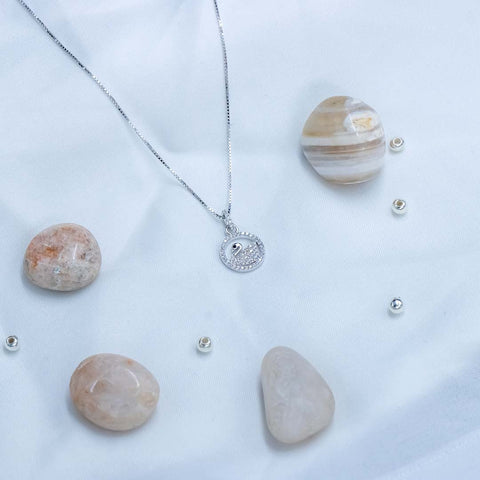 Silver round with duck shape pendant with chain