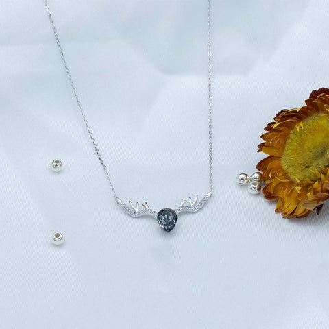 Silver pear shape black diamond studded deer pendant with chain
